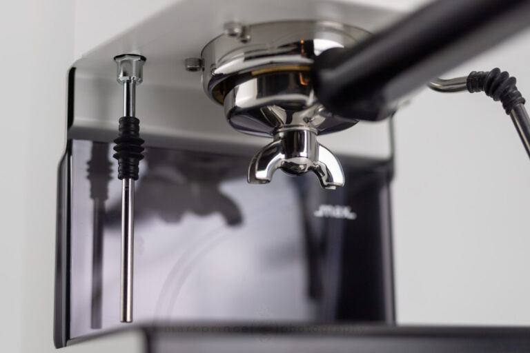 Looking up at the Gaggia Classic portafilter spouts while it sits in the machine