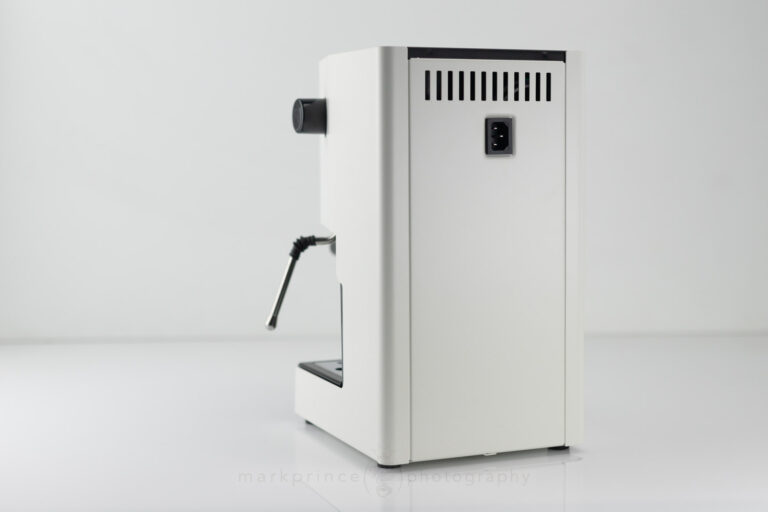 Power cord plug on the back of a Gaggia Classic, sitting high on the body