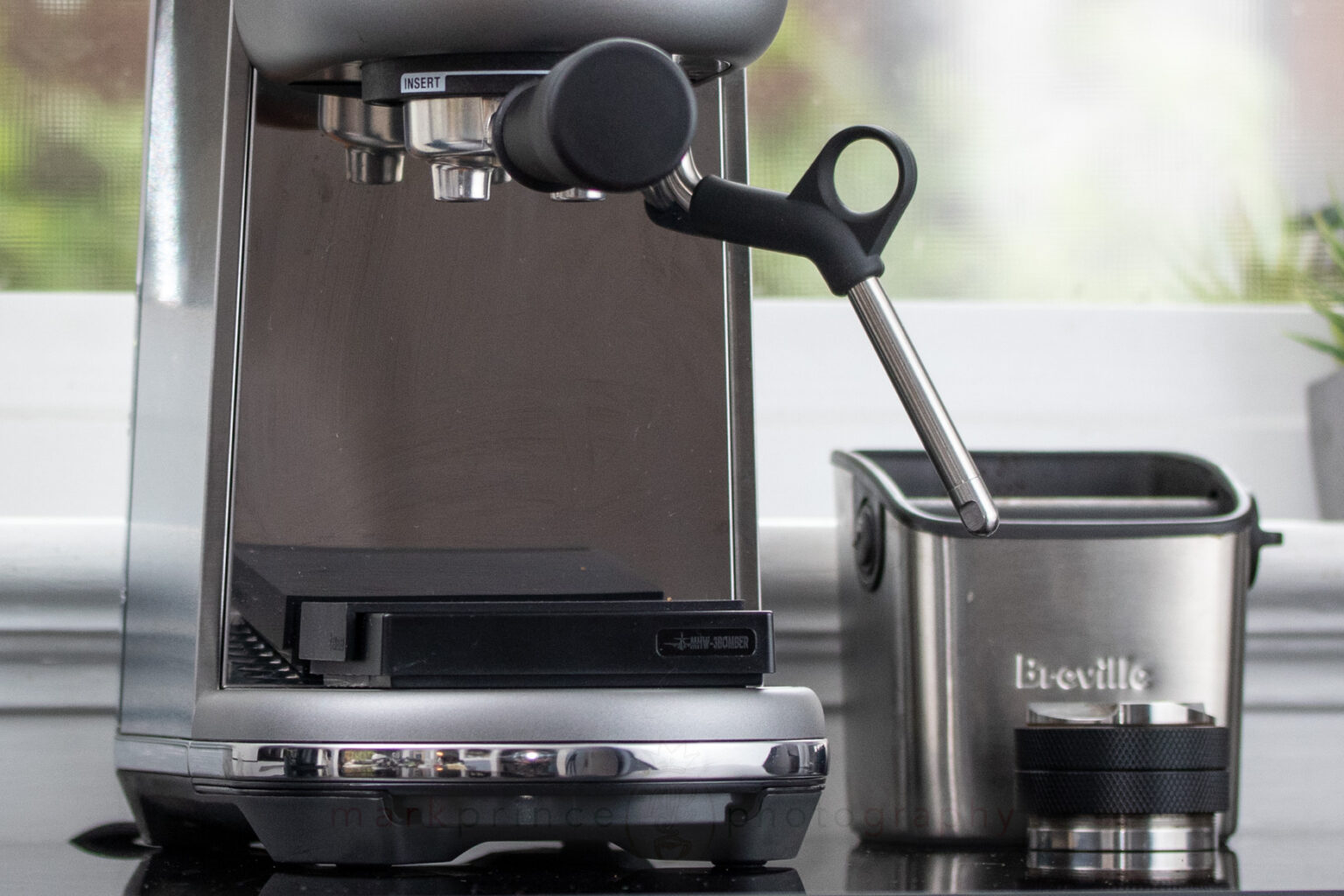 The cup clearance on this machine puts most Italian machines to shame. Check it with a scale in place.