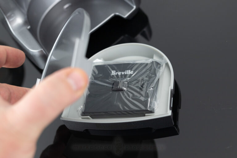 Inside the grinds tray base, is an adjustable Razor Tool!