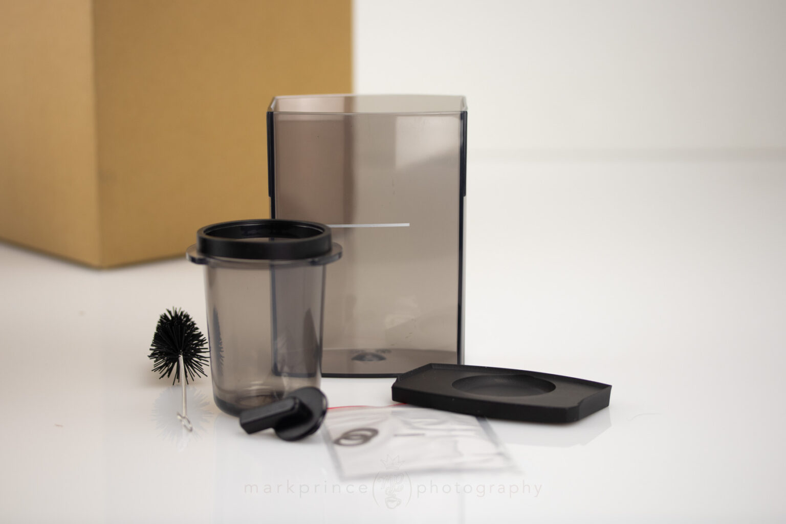 Here's all the rest of the parts with the grinder, including dosing cup, dose cup plate, brush, dial knob, and burr shims.