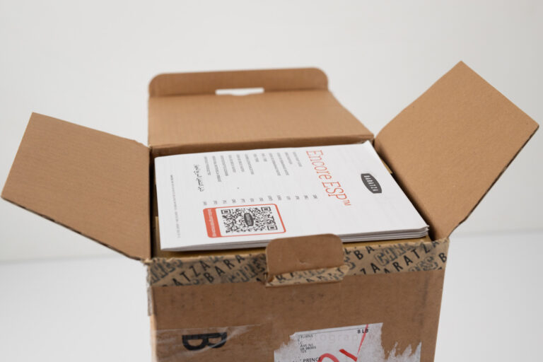 Opening the lid on the box shows the product manual up top.