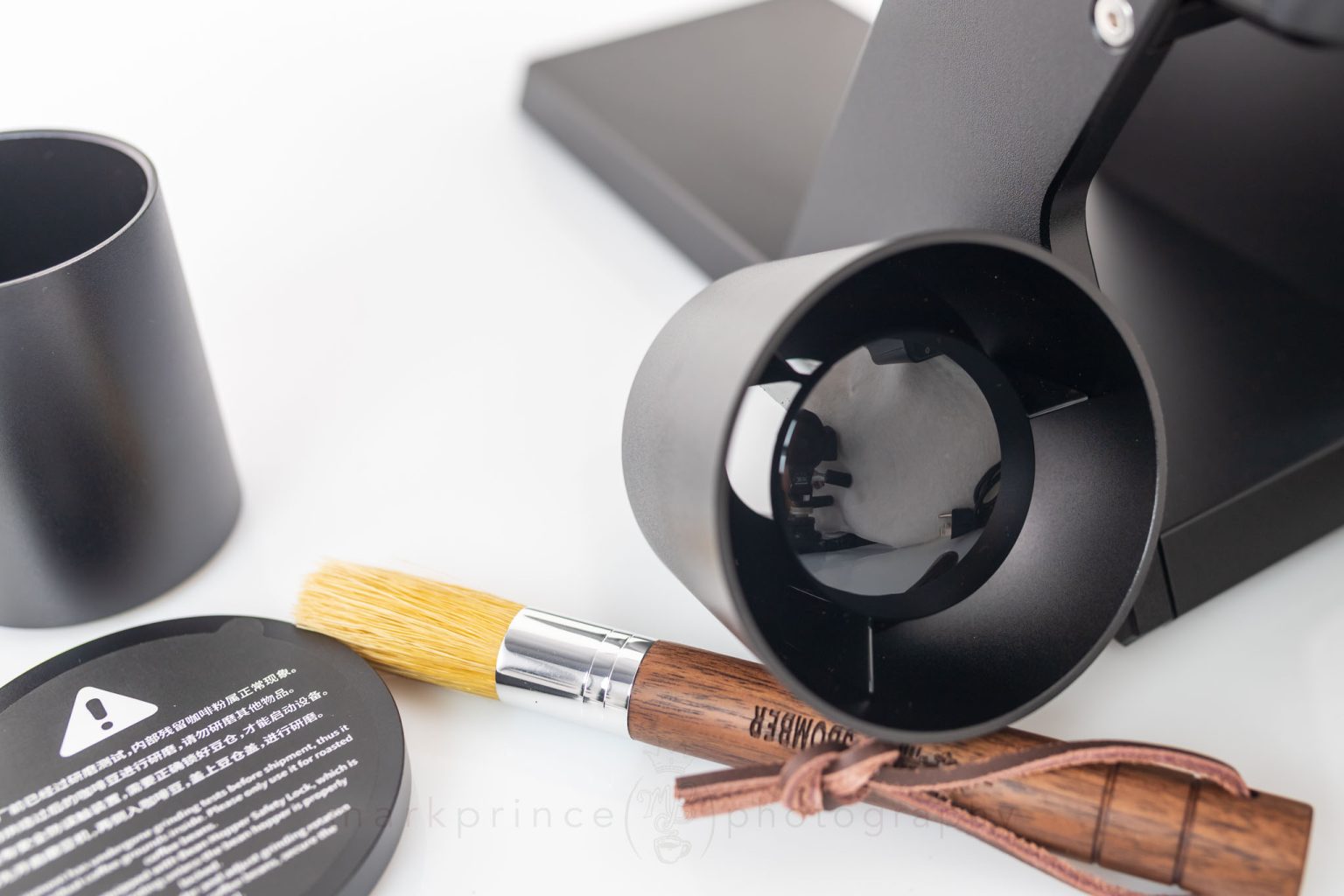 The hopper is also magnetized and slots into the top of the machine via click channels. The grinder won't run without it in place.