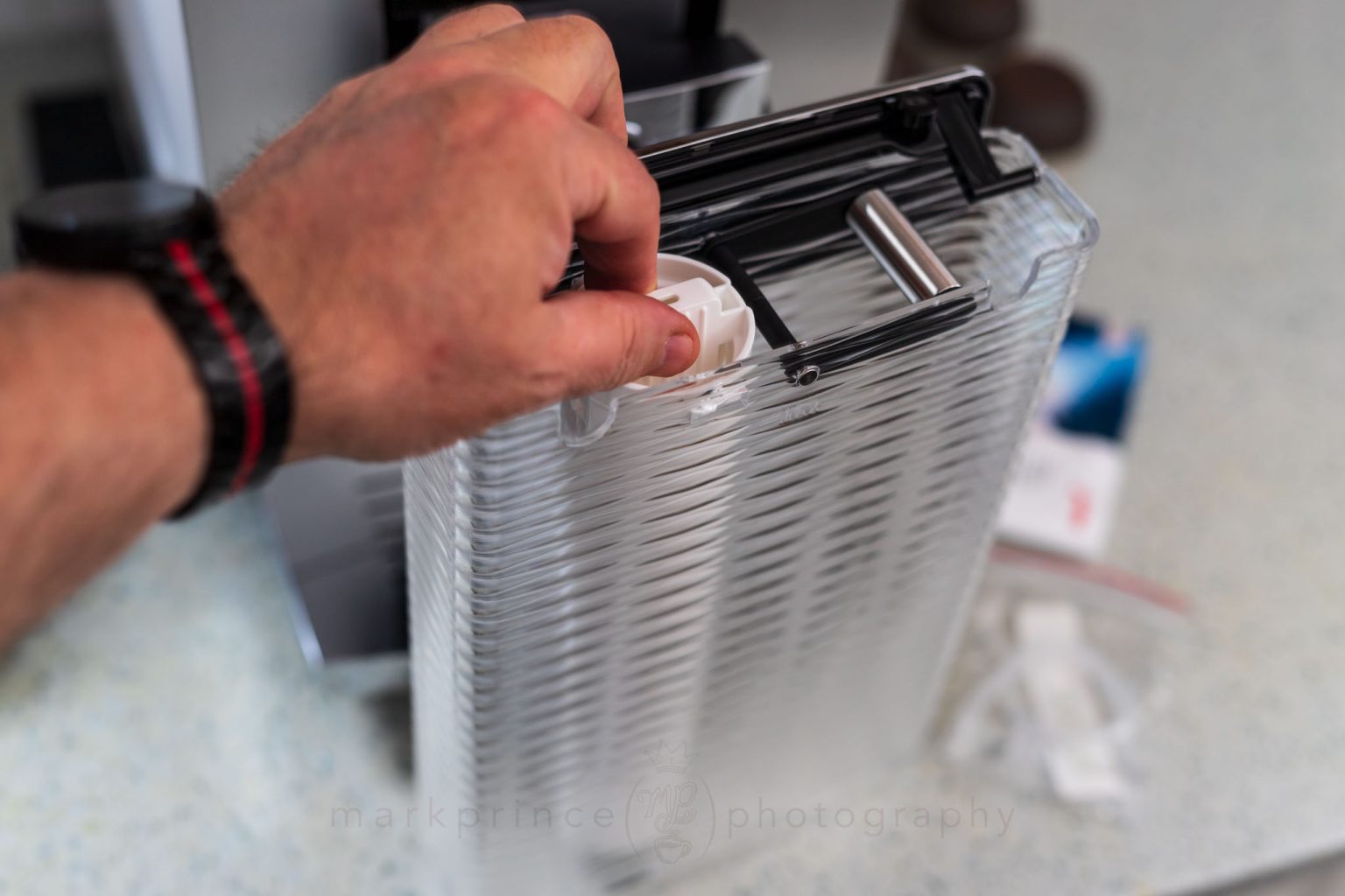 Insert it all in the reservoir. The machine will read and track the filter.