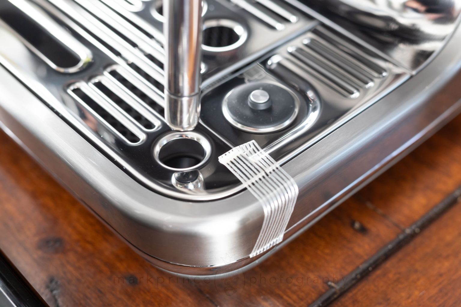 Lots of sticky tape on the machine to hold down various parts. Remove it all.