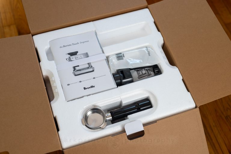 All that horrible styrofoam. But hey, there's some stuff - the manual, portafilter and water filter!